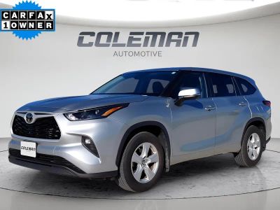 2024 Toyota Highlander LE in Silver — front three-quarter view