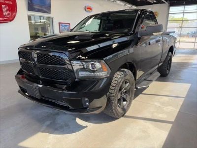 2015 RAM 1500 Sport in Black — front three-quarter view