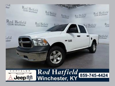 2018 RAM 1500 Tradesman Crew Cab 4x4 5'7' Box in Bright White Clearcoat — front three-quarter view