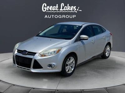 2012 Ford Focus SEL in Ingot Silver — front three-quarter view