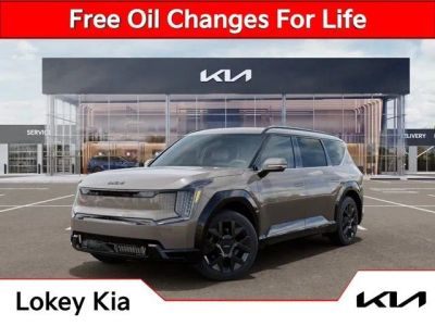 2026 Kia EV9 Land in Brown — front three-quarter view