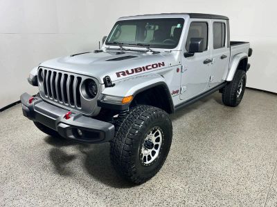 2023 Jeep Gladiator Rubicon in Silver Zynith Clearcoat — front three-quarter view