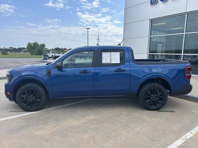 2024 Ford Maverick XLT in Atlas Blue Metallic — front three-quarter view