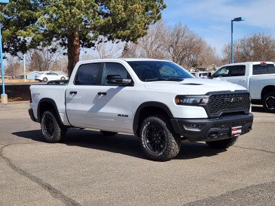 2026 RAM 1500 RAM 1500 REBEL CREW CAB 4X4 5'7' BOX in Bright White Clear-Coat Exterior Paint — front three-quarter view