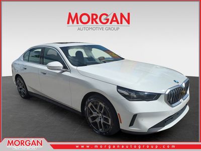 2026 BMW 5 Series 530i in Alpine White — front three-quarter view