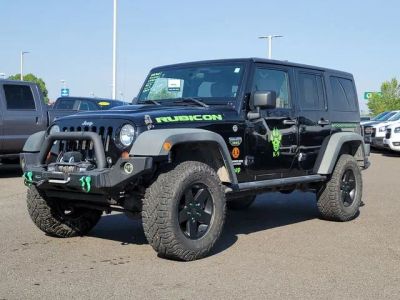 2012 Jeep Wrangler Unlimited Rubicon in Black Clearcoat — front three-quarter view