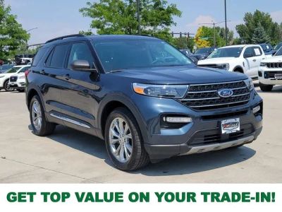 2023 Ford Explorer XLT in Stone Blue Metallic — front three-quarter view
