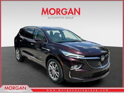 2022 Buick Enclave Avenir in Red — front three-quarter view