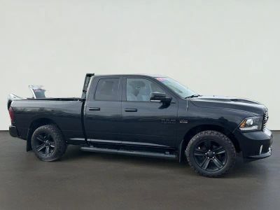 2017 RAM 1500 Sport in Brilliant Black Crystal Pearlcoat — front three-quarter view