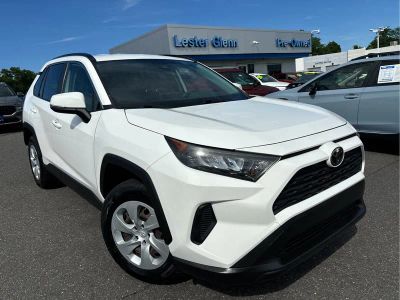 2019 Toyota RAV4 LE in Super White — front three-quarter view