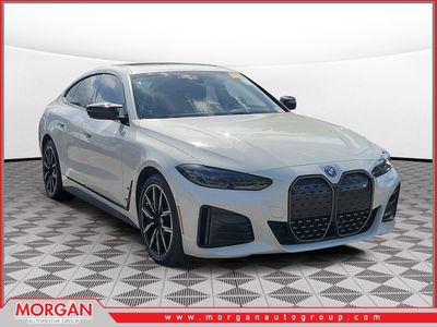 2024 BMW i4 M50 in Alpine White — front three-quarter view