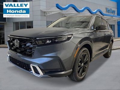 2026 Honda CR-V Hybrid Sport Touring in Meteorite Gray Metallic — front three-quarter view