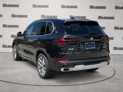 2026 BMW X5 — rear three-quarter view