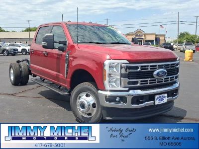 2026 Ford F-350SD XLT DRW in Ruby Red Metallic — front three-quarter view