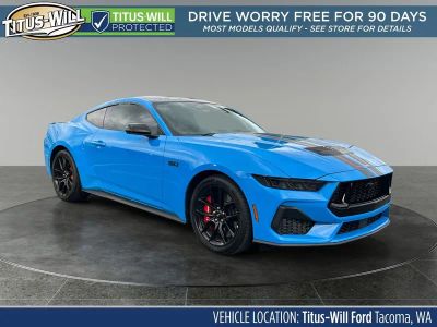 2025 Ford Mustang GT in Grabber Blue Metallic — front three-quarter view