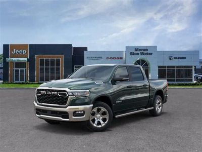 2026 RAM Ram 1500 RAM 1500 BIG HORN CREW CAB 4X4 5'7' BOX in Serrano-Green Metallic Exterior Paint — front three-quarter view