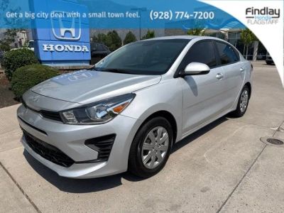 2023 Kia Rio S in Silky Silver — front three-quarter view