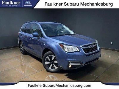 2018 Subaru Forester 2.5i Limited CVT in Quartz Blue Pearl — front three-quarter view