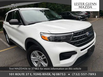 2023 Ford Explorer XLT in Star White Metallic Tri-Coat — front three-quarter view