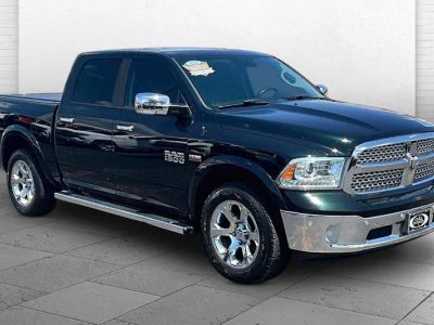 2016 RAM 1500 Laramie in Black Forest Green Pearlcoat — front three-quarter view