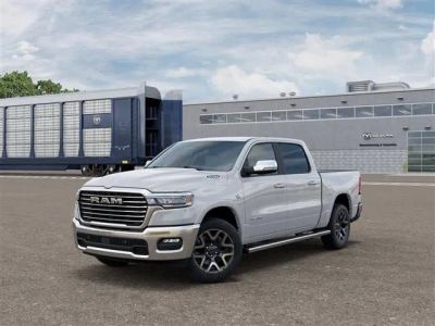 2026 RAM Ram 1500 RAM 1500 LARAMIE CREW CAB 4X4 5'7' BOX in Bright White Clear-Coat Exterior Paint — front three-quarter view