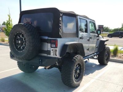 2015 Jeep Wrangler — rear three-quarter view