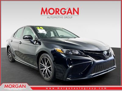 2024 Toyota Camry SE in Black — front three-quarter view