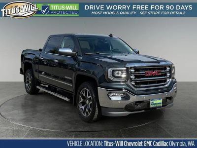 2017 GMC Sierra 1500 SLT in Dark Slate Metallic — front three-quarter view