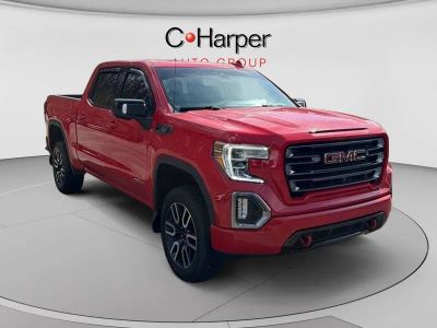 2021 GMC Sierra 1500 AT4 in Cardinal Red — front three-quarter view