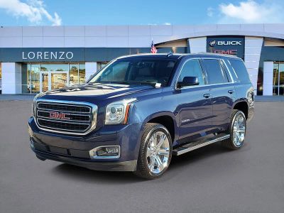 2019 GMC Yukon SLT in Dark Sapphire Blue Metallic — front three-quarter view