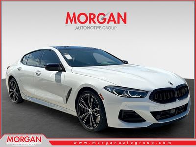2023 BMW 8 Series M850i in Alpine White — front three-quarter view