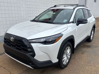 2026 Toyota Corolla Cross LE in Wind Chill Pearl — front three-quarter view