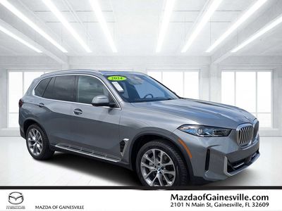 2024 BMW X5 sDrive40i in Gray — front three-quarter view