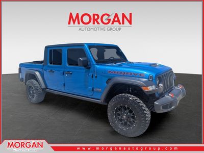 2022 Jeep Gladiator Mojave in Hydro Blue Pearlcoat — front three-quarter view
