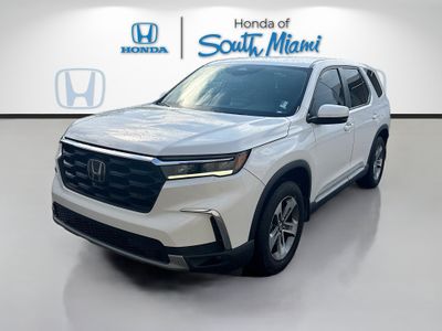2023 Honda Pilot EX-L 7 Passenger in Platinum White Pearl — front three-quarter view