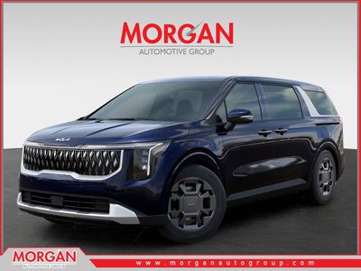 2026 Kia Carnival Hybrid EX in Deep Chroma Blue — front three-quarter view