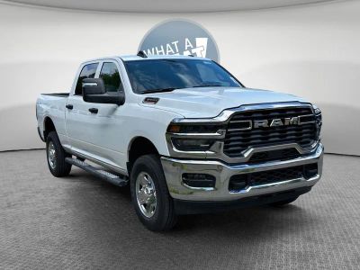 2026 RAM 3500 RAM 3500 TRADESMAN CREW CAB 4X4 6'4' BOX in Bright White Clear-Coat Exterior Paint — front three-quarter view