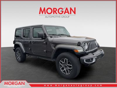 2025 Jeep Wrangler Sahara in Gray — front three-quarter view
