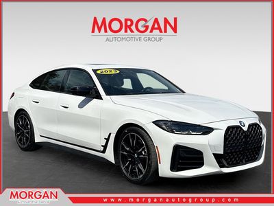 2023 BMW 4 Series M440i in Alpine White — front three-quarter view