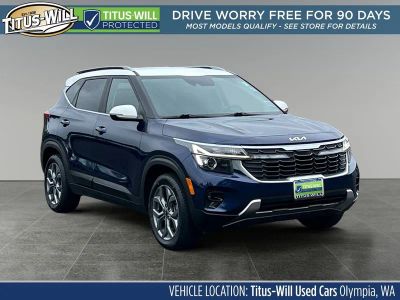 2024 Kia Seltos S in Dark Ocean Blue/White Roof — front three-quarter view