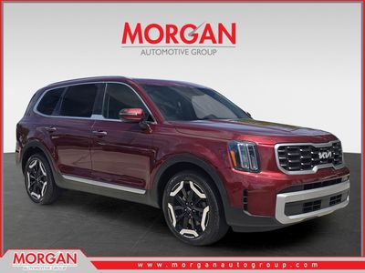 2023 Kia Telluride S in Dawning Red — front three-quarter view