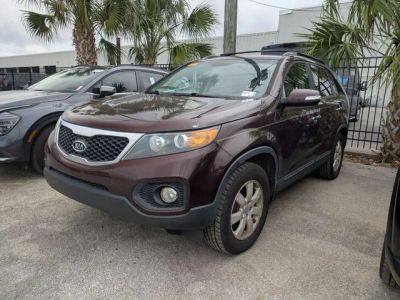2013 Kia Sorento LX in Red — front three-quarter view