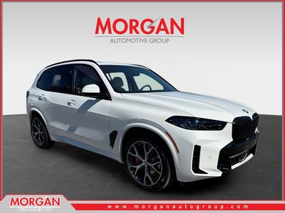 2026 BMW X5 xDrive50e in Alpine White — front three-quarter view