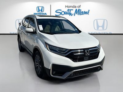 2022 Honda CR-V Touring in Platinum White Pearl — front three-quarter view