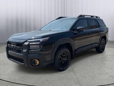 2026 Subaru OUTBACK Wilderness in Crystal Black Silica — front three-quarter view