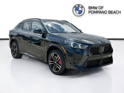 2026 BMW X2 xDrive28i in Black Sapphire Metallic — front three-quarter view