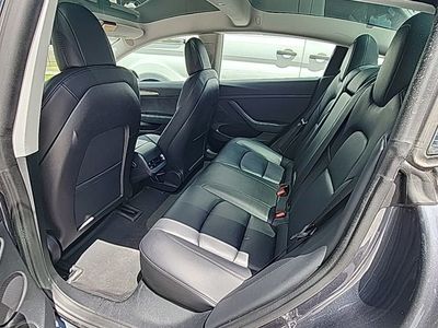 2023 Tesla Model 3 — rear three-quarter view
