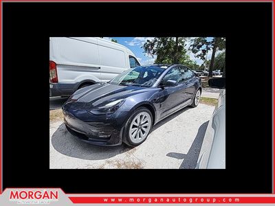 2023 Tesla Model 3 Base in Midnight Silver Metallic — front three-quarter view