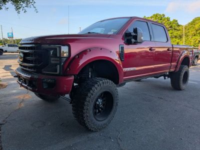 2021 Ford F-350SD Lariat in Red — front three-quarter view