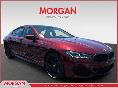 2026 BMW 8 Series 840 in Red — front three-quarter view